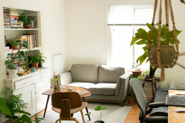 gray fabric loveseat near brown wooden table